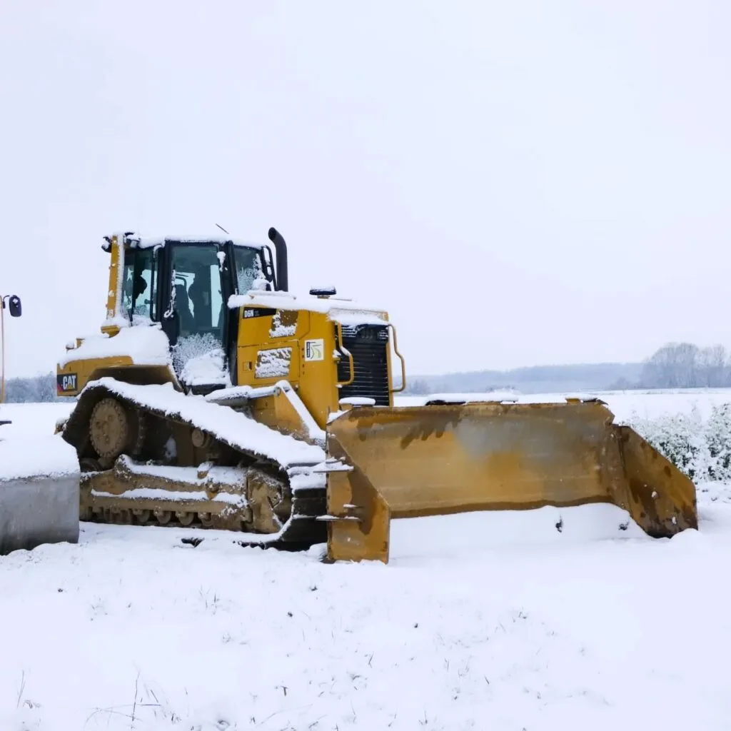 A bulldozer in the snow.